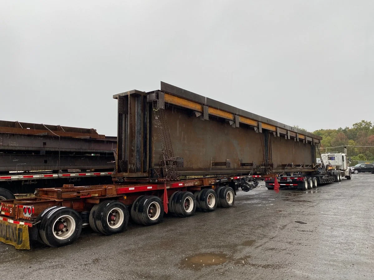 Oversized steel beam load on flatbed — All Directions Trucking escort job